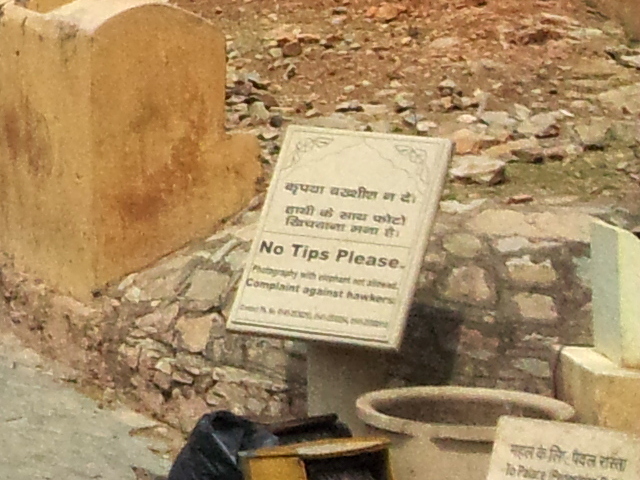 Public sign in Amer fort: No tips please. Photos with elephants are not allowed. Complaint against hawkers. Jaipur, India